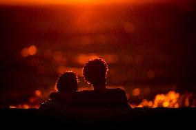 Illustration - Silhouetted at Sunset Amidst Vancouver Island Wildfires - Canada