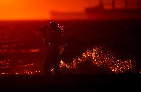 Illustration - Silhouetted at Sunset Amidst Vancouver Island Wildfires - Canada