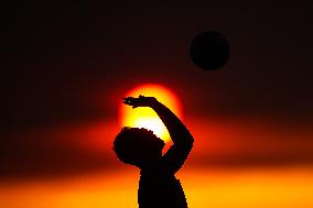 Illustration - Silhouetted at Sunset Amidst Vancouver Island Wildfires - Canada