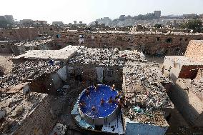 Boys Cool Off in A Pool During a Heatwave - Cairo