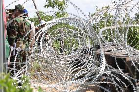 CAMBODIA-BANTEAY MEANCHEY-THAILAND-BORDER-BARBED WIRE & TYRES