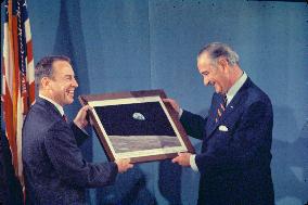 Jim Lovell Presents President Johnson with an Engraved Print of “Earthrise”