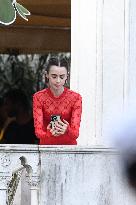 Lily Collins Takes a FaceTime Break during Emily in Paris Set - Venice
