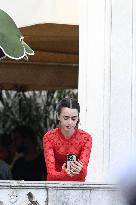 Lily Collins Takes a FaceTime Break during Emily in Paris Set - Venice