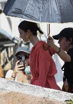 Lilly Collins Takes a Break While Filming Emily in Paris - Venice