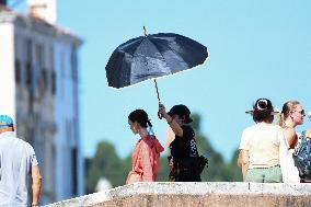 Lilly Collins Takes a Break While Filming Emily in Paris - Venice