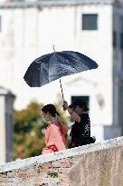 Lilly Collins Takes a Break While Filming Emily in Paris - Venice