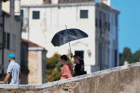 Lilly Collins Takes a Break While Filming Emily in Paris - Venice