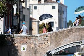 Lilly Collins Takes a Break While Filming Emily in Paris - Venice