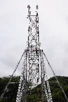 A Labourer Works on A Giant Ferris Wheel - India