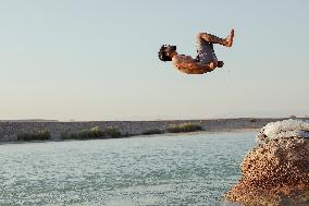 Young Iraqis Swim In The River - Erbil