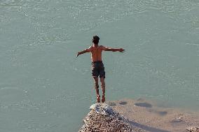 Young Iraqis Swim In The River - Erbil