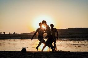 Young Iraqis Swim In The River - Erbil