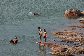 Young Iraqis Swim In The River - Erbil