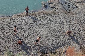 Young Iraqis Swim In The River - Erbil