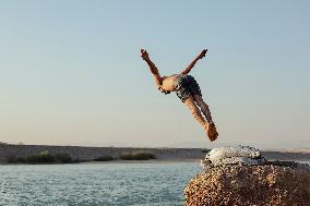 Young Iraqis Swim In The River - Erbil