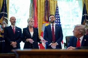 White House - Trump Signing Executive Order in The Oval Office