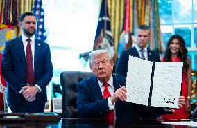 Trump Signs Executive Order In Oval Office - DC