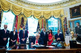 Trump Signs Executive Order In Oval Office - DC