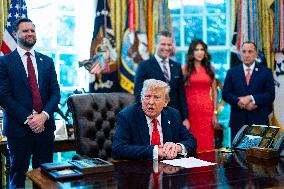 Trump Signs Executive Order In Oval Office - DC