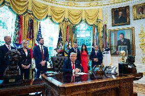 Trump Signs Executive Order In Oval Office - DC