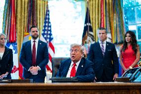 Trump Signs Executive Order In Oval Office - DC