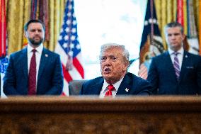 Trump Signs Executive Order In Oval Office - DC