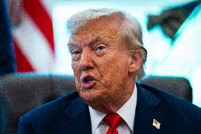 Trump Signs Executive Order In Oval Office - DC