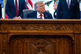 Trump Signs Executive Order In Oval Office - DC