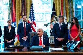 Trump Signs Executive Order In Oval Office - DC