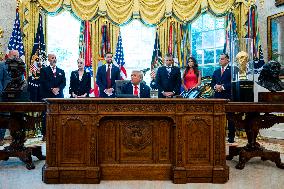 Trump Signs Executive Order In Oval Office - DC