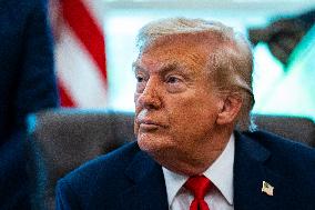 Trump Signs Executive Order In Oval Office - DC