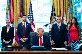 Trump Signs Executive Order In Oval Office - DC