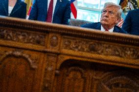 Trump Signs Executive Order In Oval Office - DC