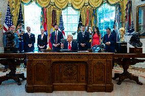 Trump Signs Executive Order In Oval Office - DC