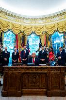 Trump Signs Executive Order In Oval Office - DC