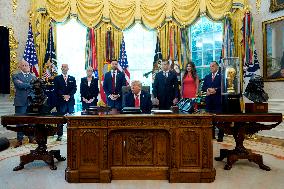 Trump Signs Executive Order In Oval Office - DC