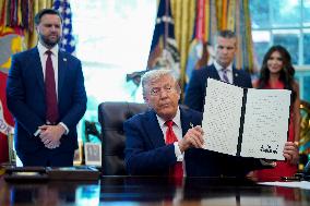 Trump Signs Executive Order In Oval Office - DC