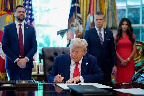 Trump Signs Executive Order In Oval Office - DC