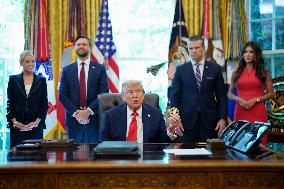 Trump Signs Executive Order In Oval Office - DC