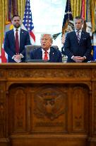 Trump Signs Executive Order In Oval Office - DC