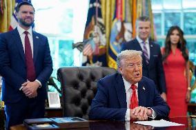 Trump Signs Executive Order In Oval Office - DC