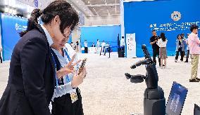 Robots Welcome World Media At The SCO - Tianjin