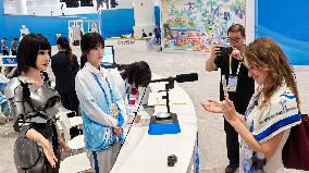 Robots Welcome World Media At The SCO - Tianjin