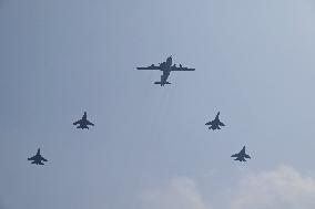 Citizens Watch Military Parade Aircraft in Beijing