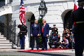 Trump greets President Karol Nawrocki of Poland on the South Portico of the White House