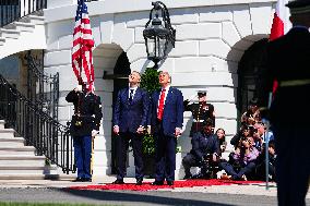 Trump greets President Karol Nawrocki of Poland on the South Portico of the White House