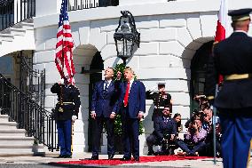 Trump greets President Karol Nawrocki of Poland on the South Portico of the White House