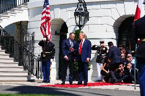 Trump greets President Karol Nawrocki of Poland on the South Portico of the White House