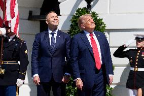 Trump greets President Karol Nawrocki of Poland on the South Portico of the White House